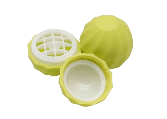 レモン色のリップ・クリームの容器のねじ帽子が付いている球形のプラスチック リップ・クリームの管