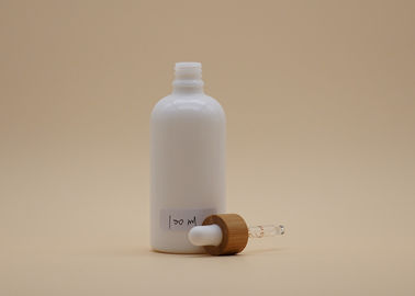 シリンダー形の白いガラス点滴器は化粧品の包装のための100mlをびん詰めにします